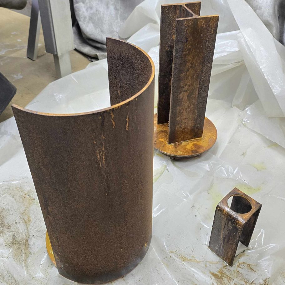 Sype 019 – Controlled Steel Oxidation Oxidized steel components of Sype 019 showing the rich rust textures created through controlled metal oxidation.