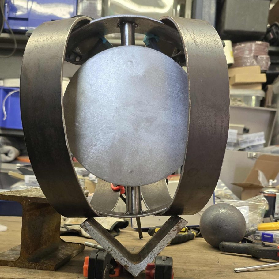 Sype 021 – First Steel Sculpture Experiment Early sculptural lighting experiment inspired by Sype 021, combining circular steel forms and a central metal disc.
